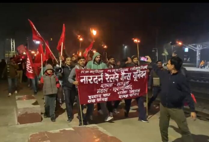 Railway employees taking out torch procession