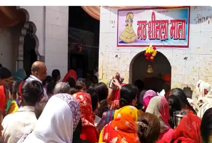 Devotees arrived to offer prayers at Sheela Mata Temple