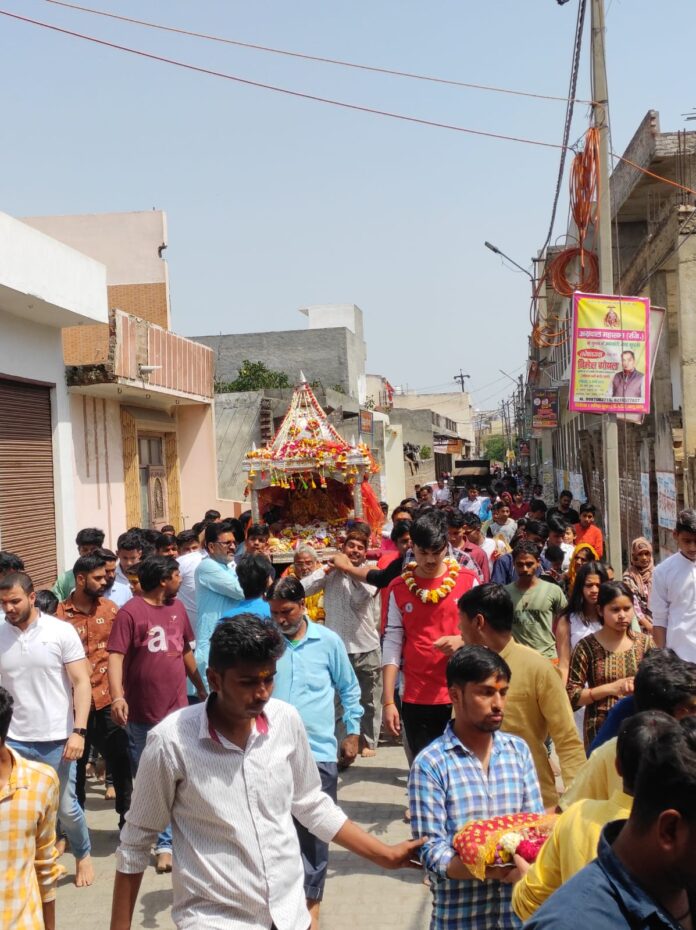 Devotees taking part in palanquin procession