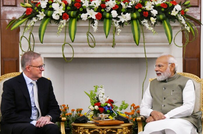 PM Narendra Modi talking to the Prime Minister of Australia