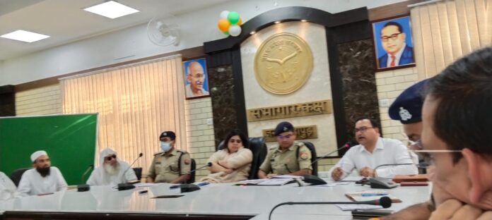 Police and administration officials participating in the peace committee meeting