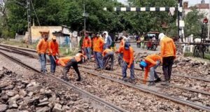 employees working on railway tracks