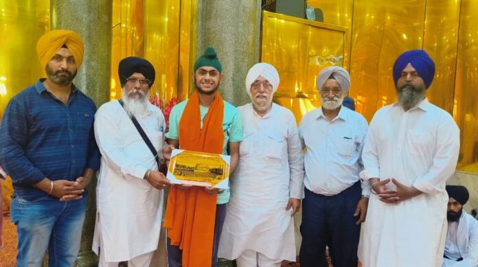 Honoring meritorious student Rajdeep Singh