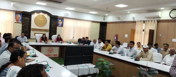 Observer Medha Rupam taking a meeting in the Collectorate Auditorium