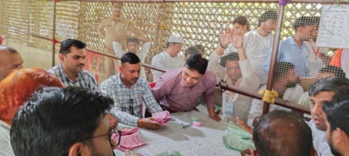 Voters counting votes at the counting center