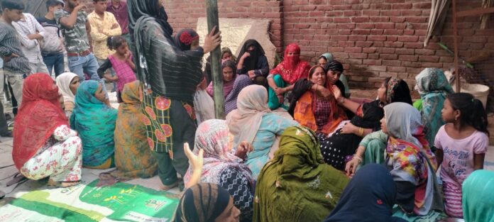 Women mourning after the murder of a young man