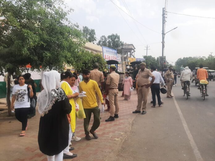 Candidates standing outside the BED EXAM exam center