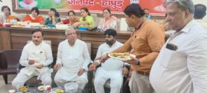 MP, MLA and District President having food in tiffin meeting