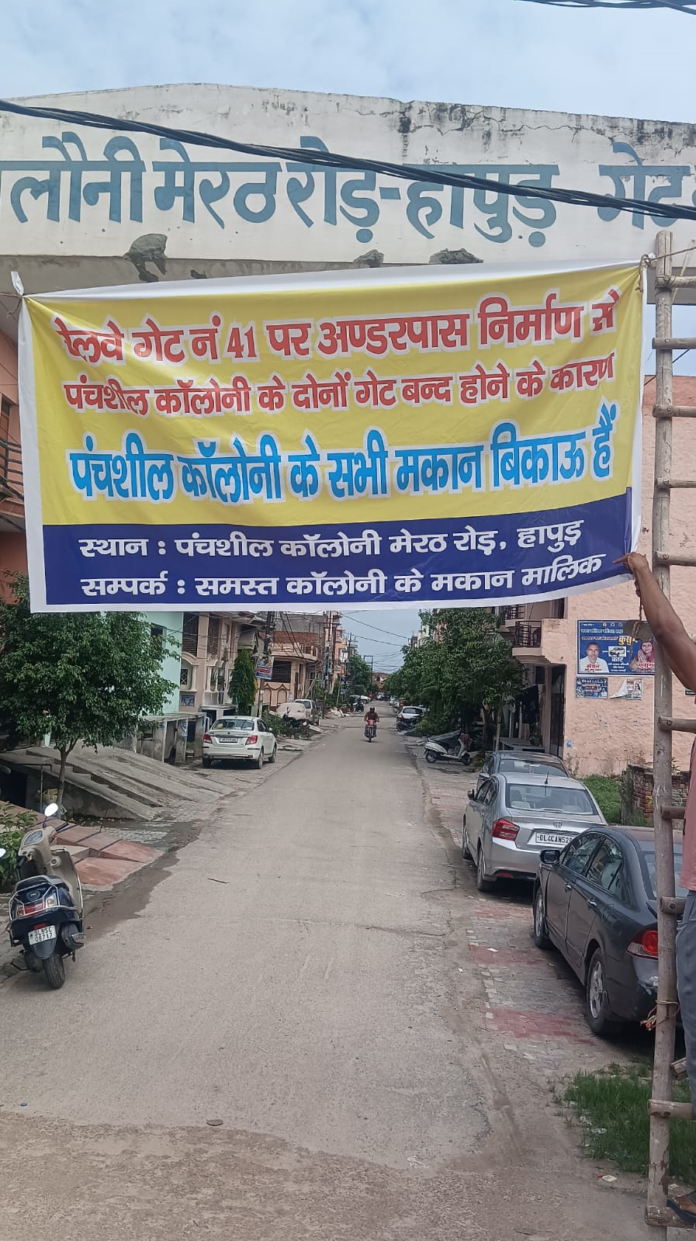 Banner on the gate of Panchsheel Colony 3