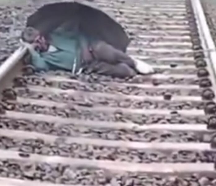 Man Sleep on Railway Track